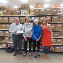 At the Cheshire Food Pantry, Calcagni Real Estate agents Bev Welch and Marilyn Rock delivery a check to Dave DeFeo and Lianne Fuller in memory of Frank Loehmann Jr